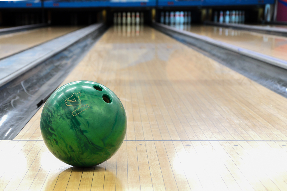 Bowling oil patterns begin after the dots on the floor and the horizontal line that connects the gutters. Crossing the horizontal line is not safe.