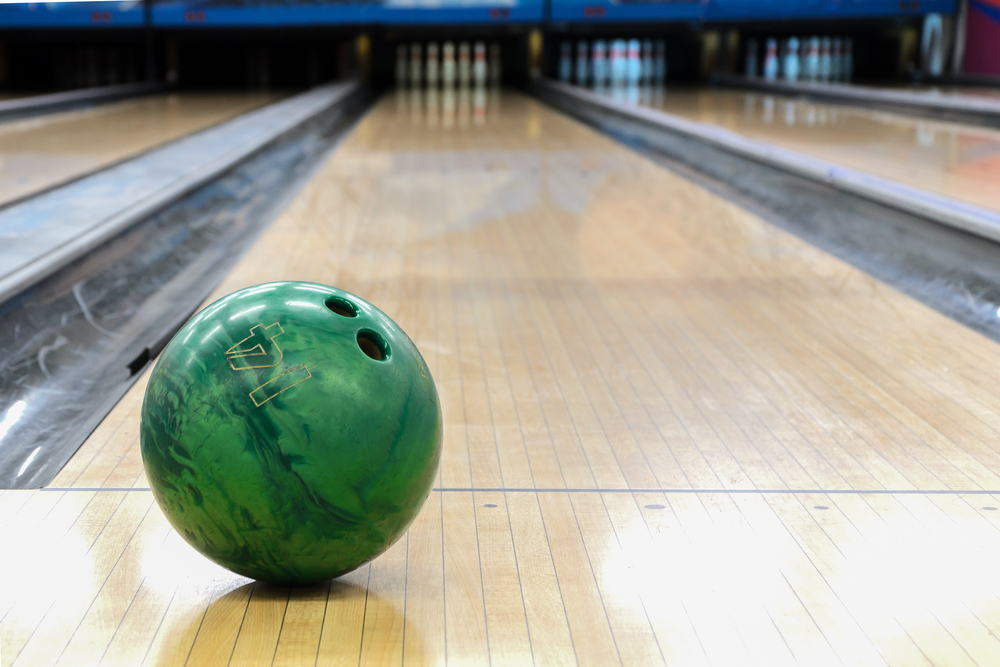 Bowling oil patterns begin after the dots on the floor and the horizontal line that connects the gutters.