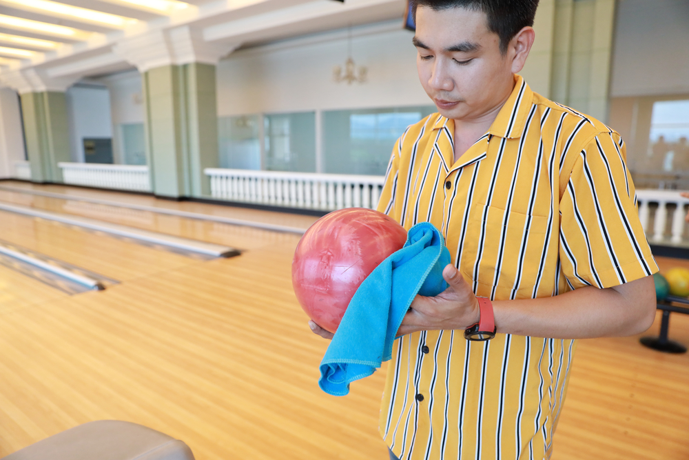 Proper bowling tips include wiping the ball with a microfiber, lint free towel after every bow..