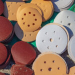 A sanding pad is one of the various tools used when a bowling ball is resurfaced.