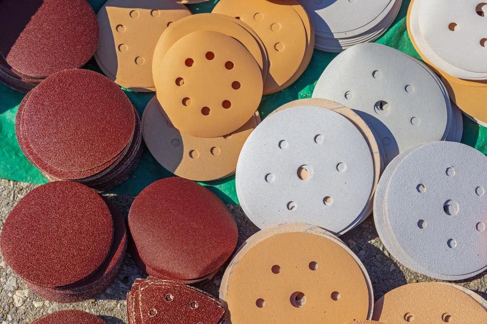 A sanding pad is one of the various tools used when a bowling ball is resurfaced.