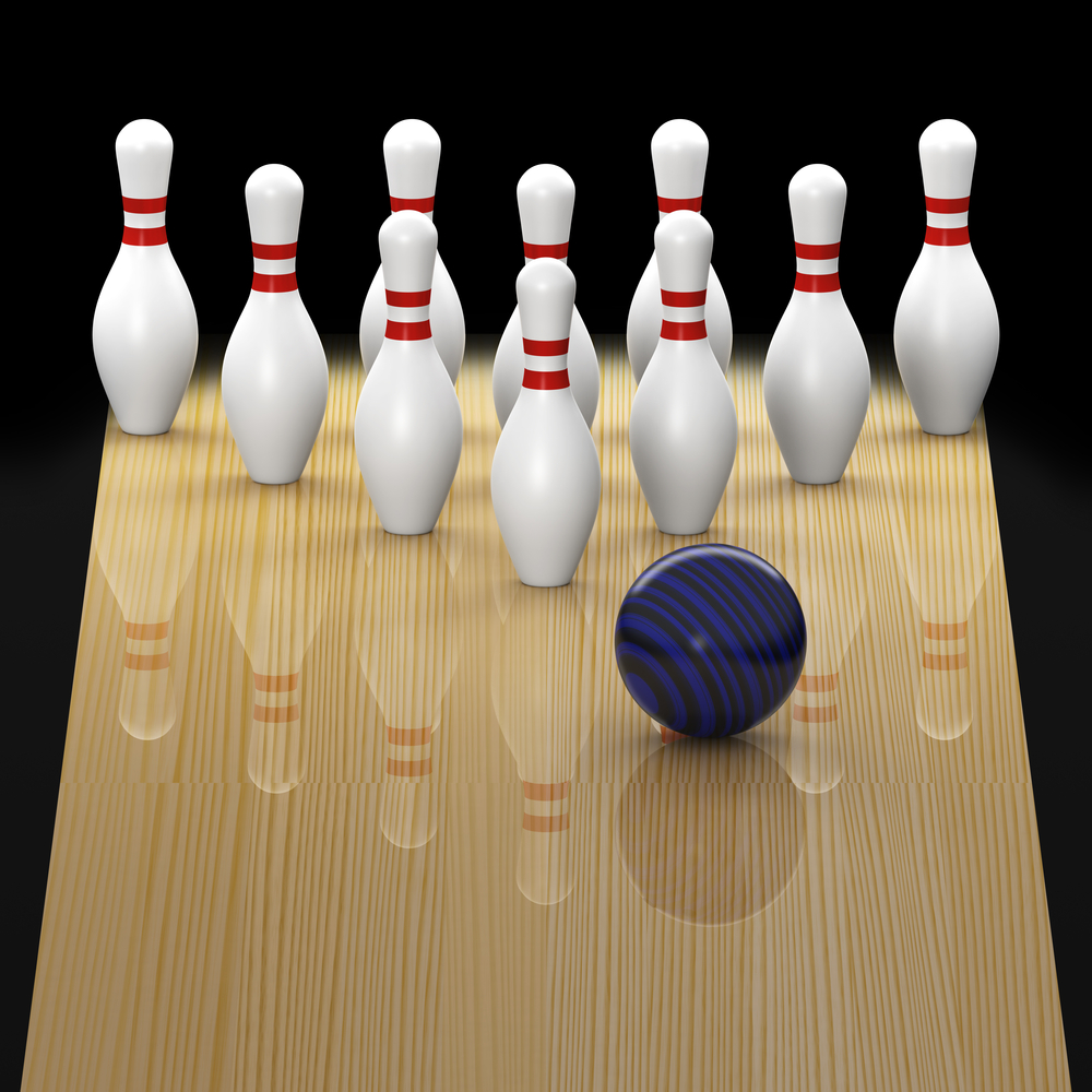 The image shows a bowling ball traveling down a bowling lane toward bowling pins. As it relates to how far apart the pins are, the image shows the pins a triangle and standard with of 12 inches apart.