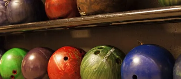 How to hold a bowling ball using middle and ring fingers