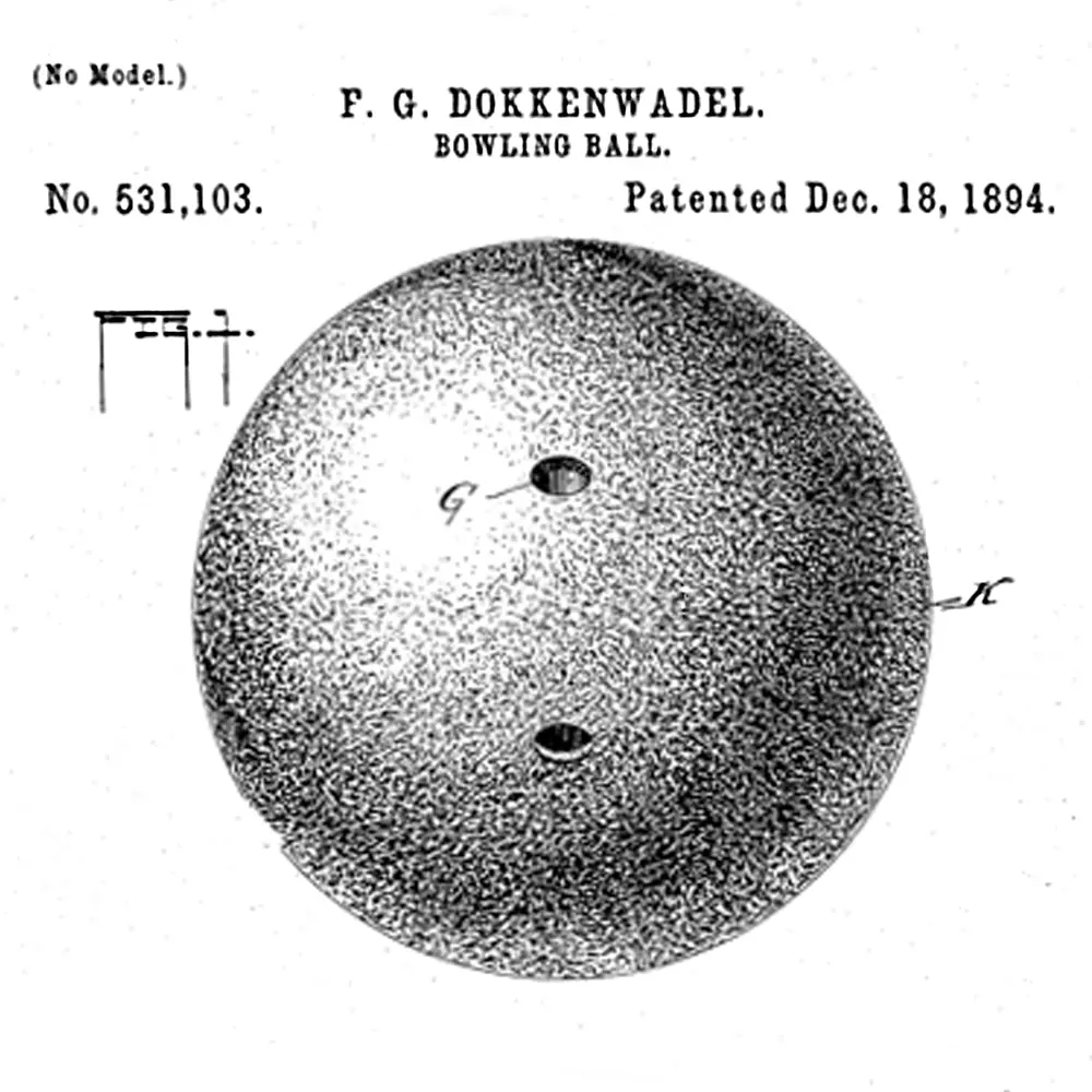 Black and white image of a bowling ball patented in 1894. There are two finger holes: one finger hole and a thumb hole.