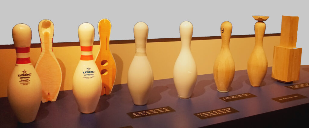 The image is of the process of creating a bowling pin from wood to finished product. As it relates to how much do bowling pins weigh, it helps to see the inside of the pin displayed.