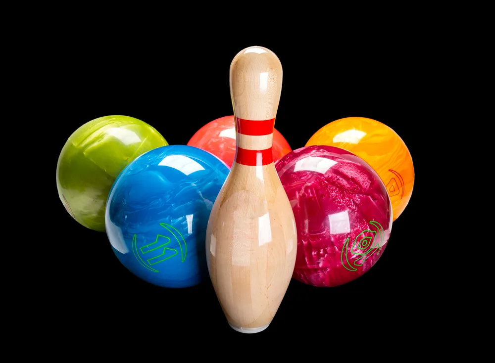 A group of floating bowling balls sink in freshwater and float in salt water - based on the buoyant force.