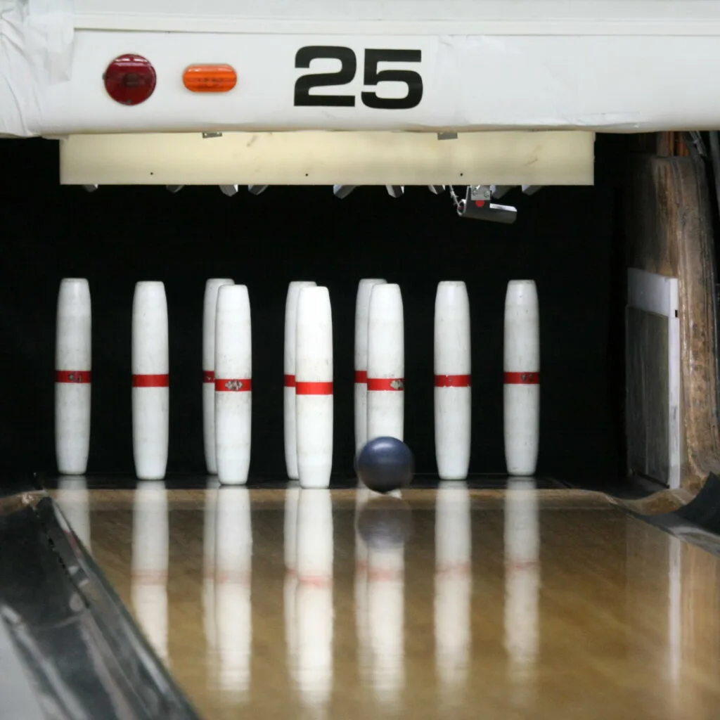 This image is of a standard candlepin ball and 10 candlepins.