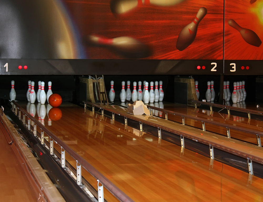 This image is of a bowling ball approaching the pins. As it relates to bowling and bumpers, nowadays, more people are using bumpers than ever before.