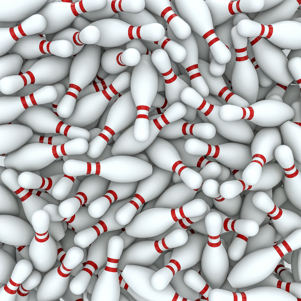 This image is of hundredths of bowling pins mixed together. As it relates to answering the question, how many pins are used in bowling, this image depicts that it depends on the type of bowling.