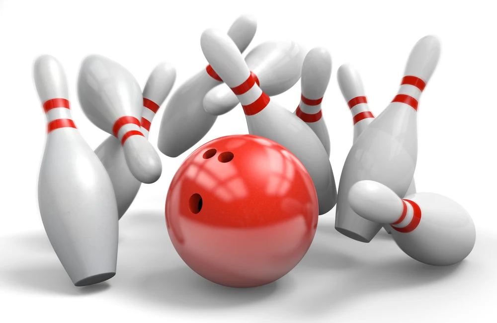 The image is of a bowling ball striking ten pins.