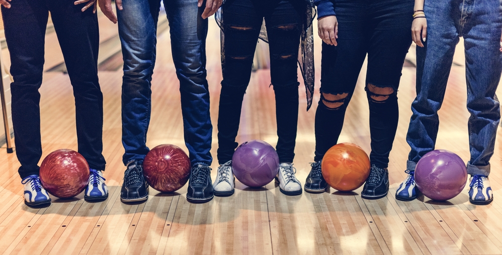 Time with friends at a bowling alley with five different bowling balls and amf bowling shoes