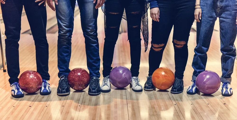 Time with friends at a bowling alley with five different bowling balls and amf bowling shoes