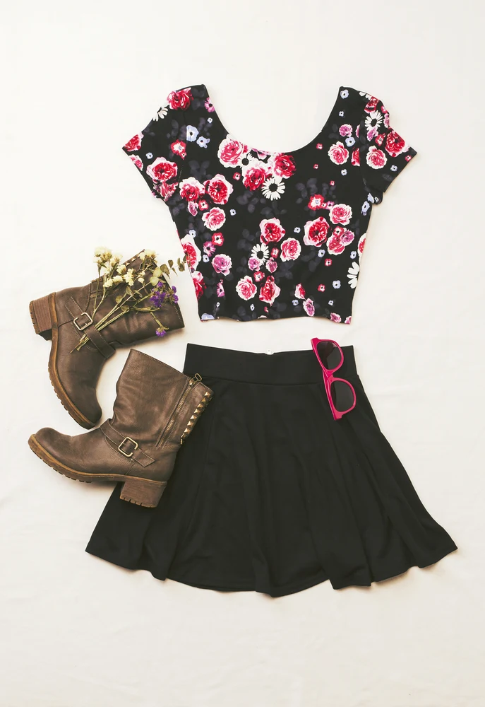 A floral short sleeve shirt can be paired with floral track pants or black skirt with boots.