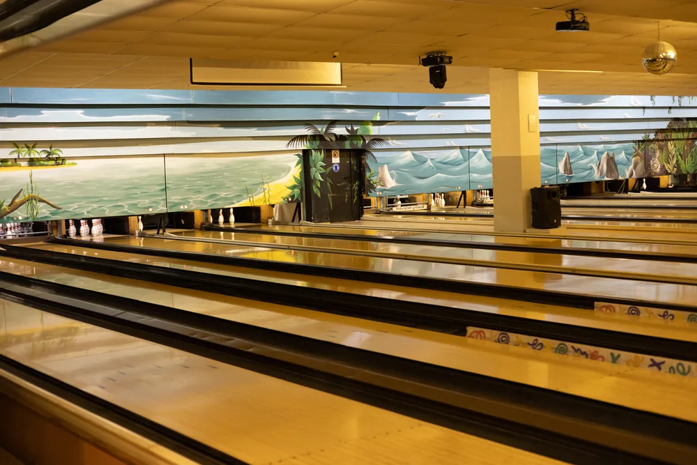 The polished diy bowling lane has a new bowling alley feel with the latest posts added and will provide a great bowling experience with painted scenery on the walls.