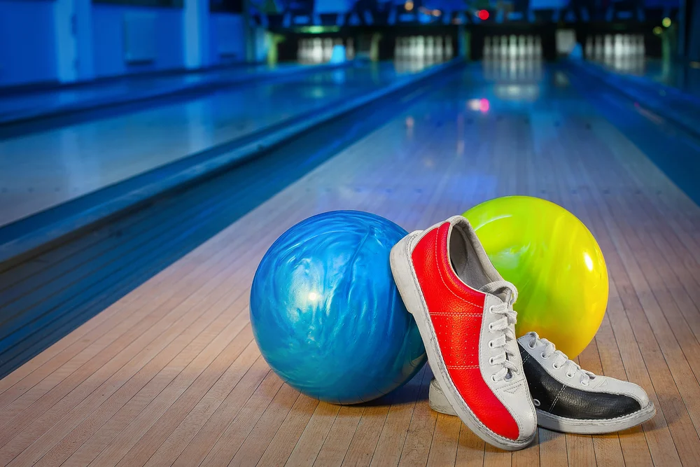 The tri colored bowling shoes, red, white and blue, were sticking and the bowler decided to switch bowling shoes because to fix sticking bowling shoes requires a deep, thorough cleaning of the  slide pad.