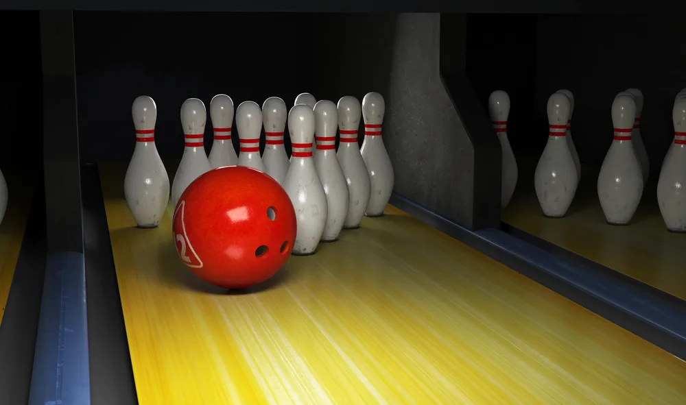 A right handed bowler has thrown three consecutive strikes and now leaves 4 remaining pins, will have to use their backup ball to get a spare.
