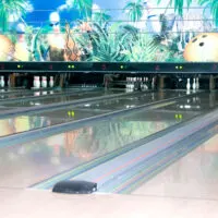 Three lanes show spares that resulted after the bowler rolled their second ball and left the pins remain standing.