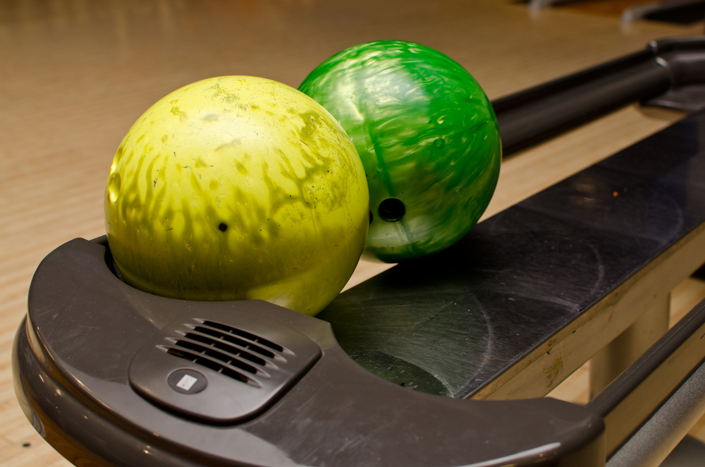 Following the league's rules, the intermediate bowlers won the strike pools as, two bowling balls, yellow and green returned from their throw.