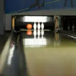 What is the difference between bumper bowling and traditional bowling