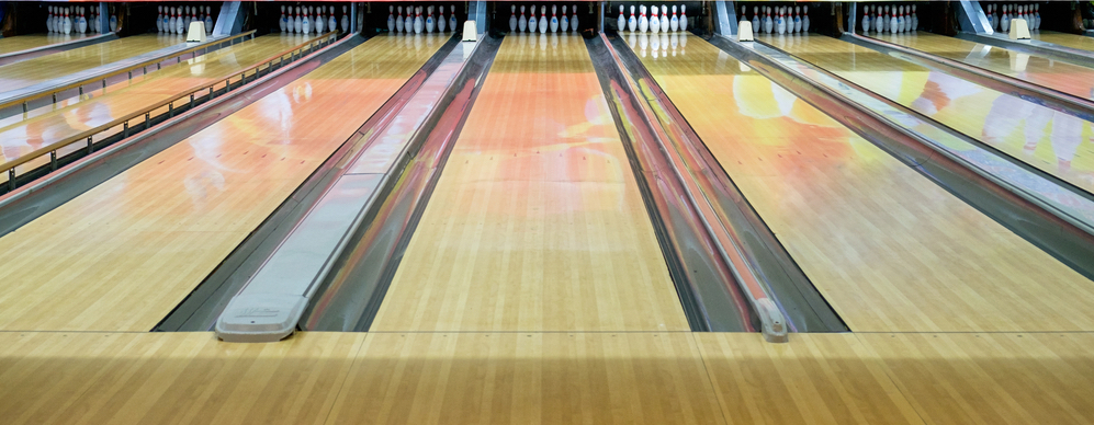 Polished lanes at an at-home bowling alley provide consistent play for family and friends and the bowling enthusiasts