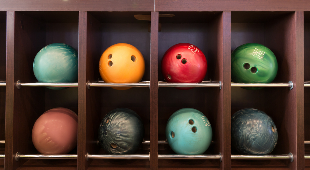 The wooden shelf of house balls was cleaned with a homemade bowling ball cleaner.