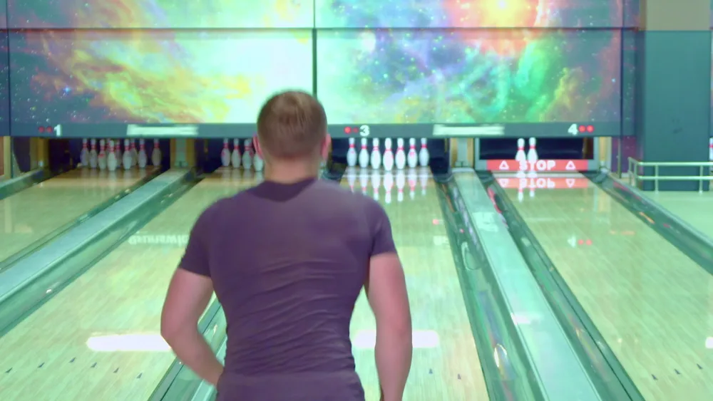 Galaxy swirls decorate the bowling wall.