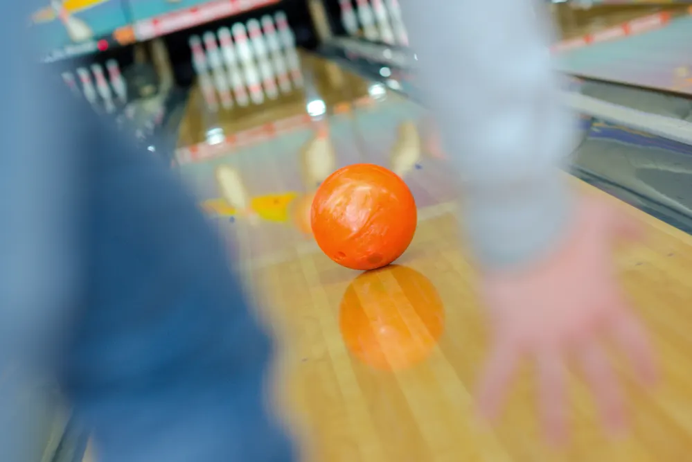 The orange ball is released in the middle of the pattern, where there is more oil concentrated.