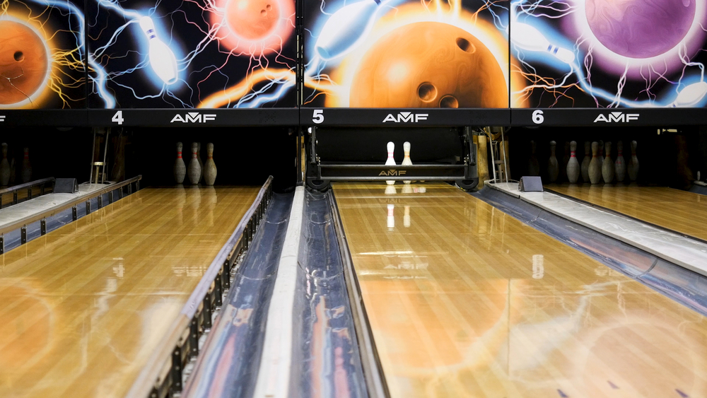 A cool bowling lane photo showing several feet from the foul line in the heart of birmingham's local bowling center.