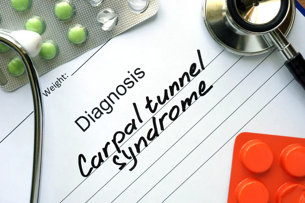 A doctor's chart shows a patient with a diagnosis of carpal tunnel syndrome from a bowling wrist injury.