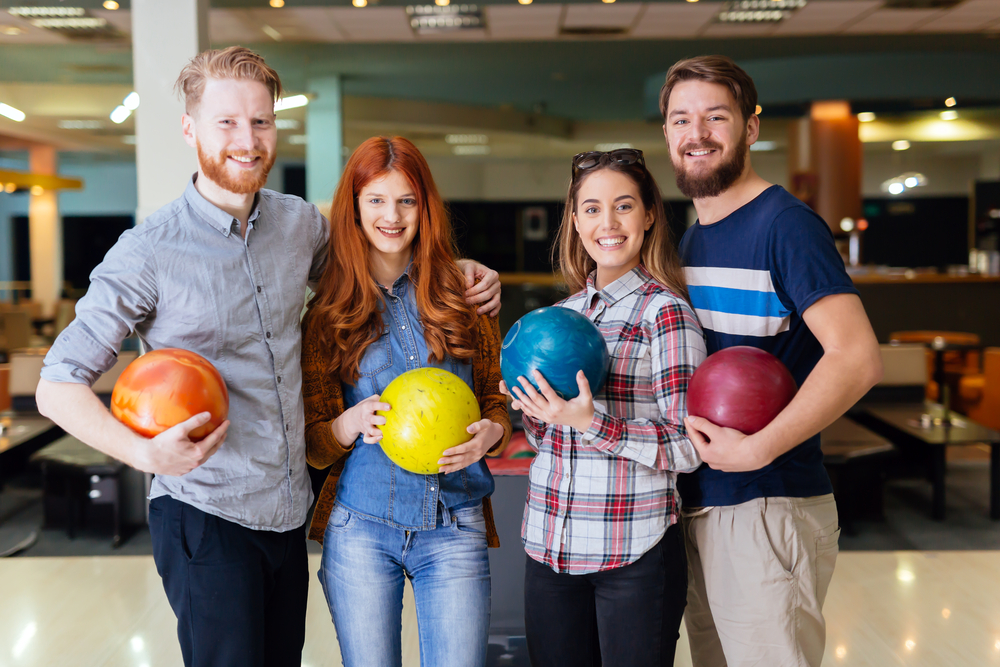 The lady with the yellow bowling ball is the league secretary who works at the bowling alley.