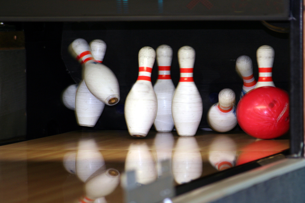 The red ball made two strikes, and all the pins were knocked down, leaving the next ball (or the last ball) useless.