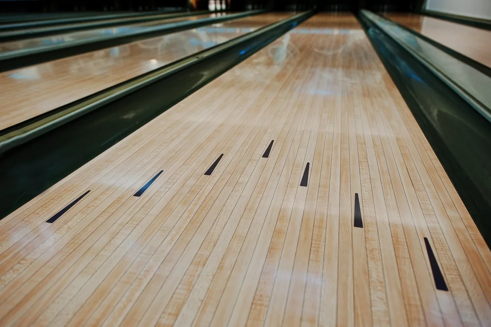How Often Should Bowling Lanes Be Oiled? 1 The lane surface is shiny because of the invisible lane conditioner