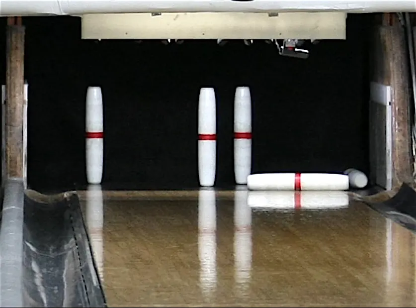 The tall slender candlepin bowling pins are the typical type you see in bowling alleys.