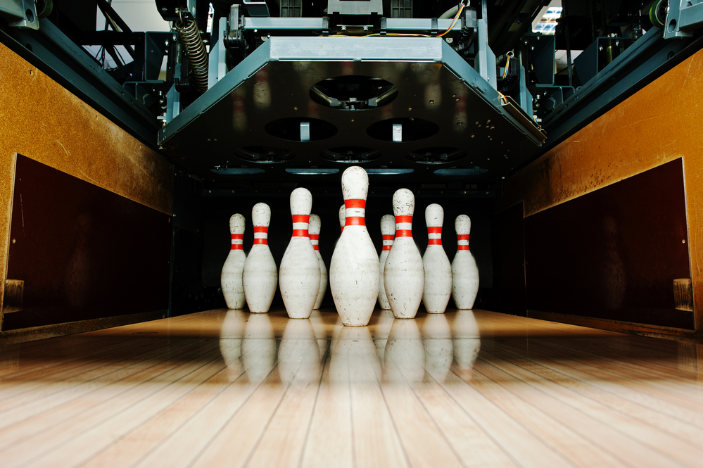 Ten pins are set up in the regulated ten pin bowling formation.