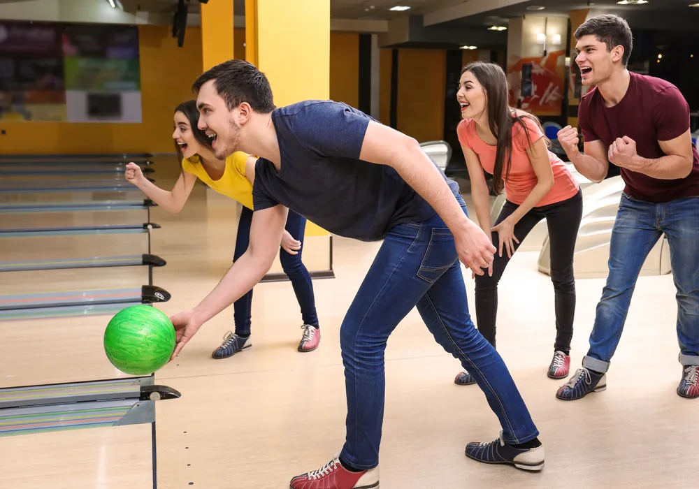 The bowler in the blue shirt had one pin remaining.