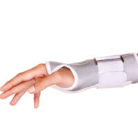 A woman's arm in a grey and white trimmed wrist brace.