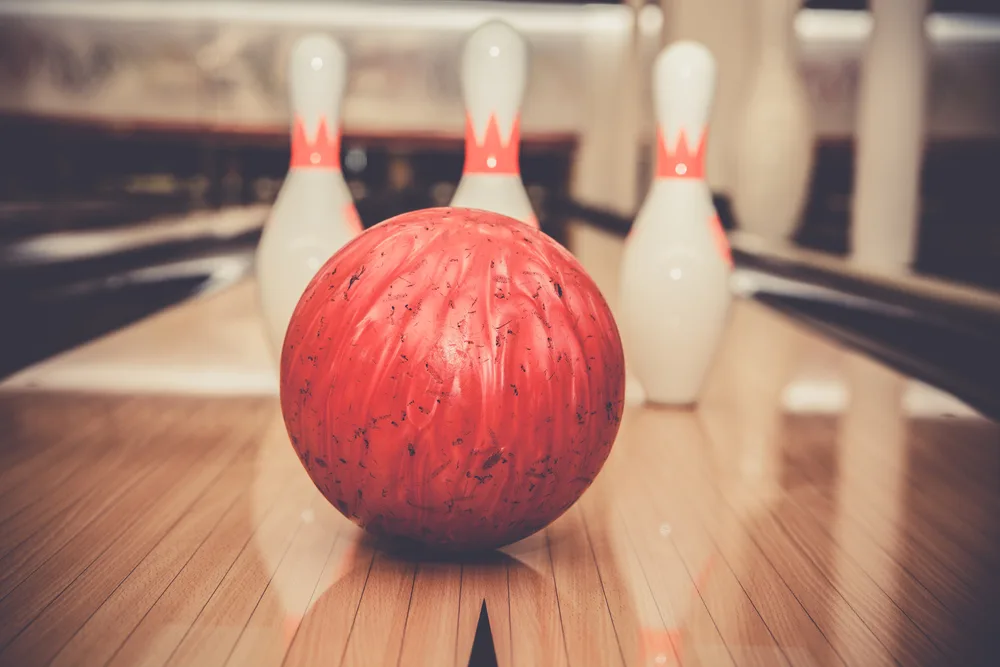 The red ball sitting on the lane has very low hook potential and would rate very low on the perfect scale.