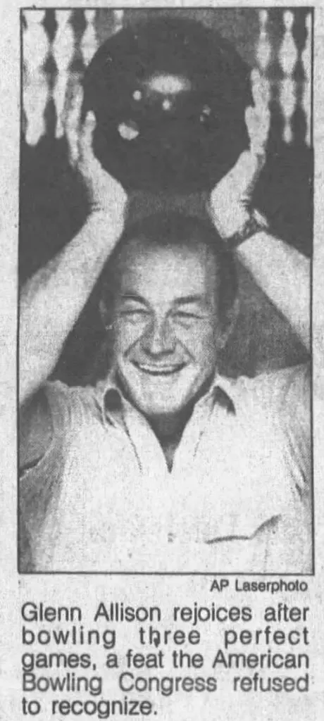 Glenn allison excitedly holds the bowling ball over his head as the first person to ever score 900.