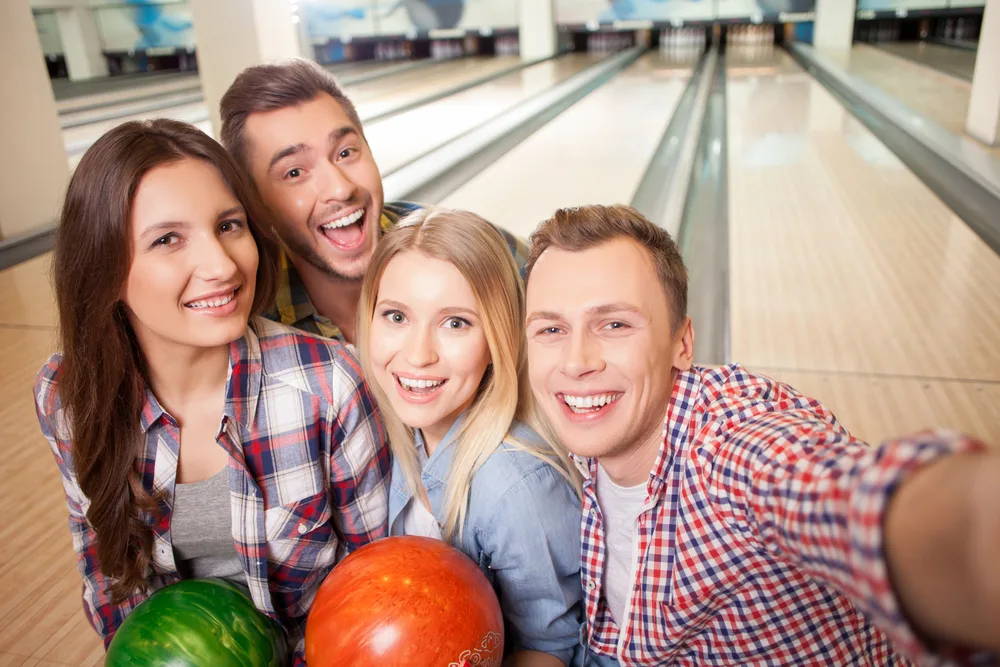 Portrait of friend bowling at red rock bowling with 72 luxury lanes taking a selfie.