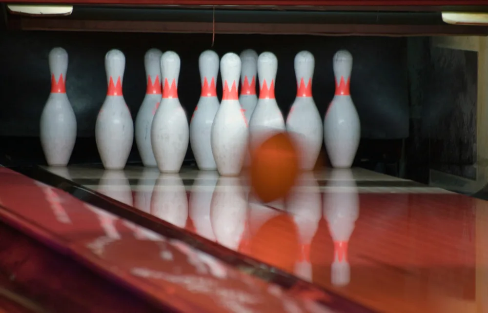 To determine match play, the last ball, the orange ball on the lane sealed the deal with a strike.