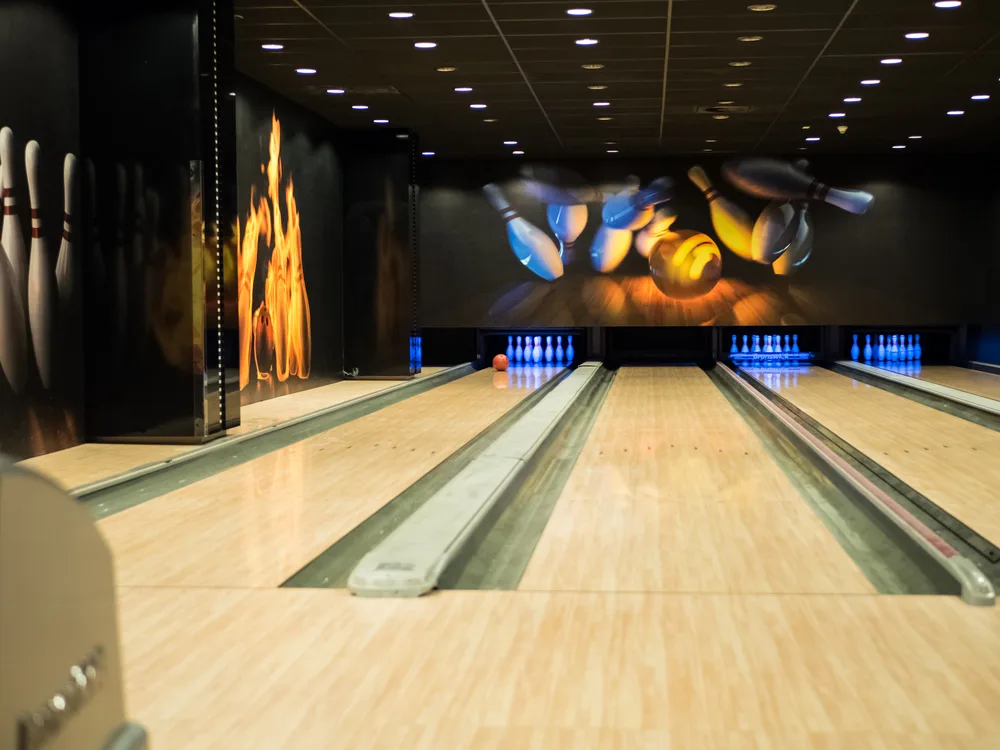 Private vip suites with four lanes bowling balls and pins.