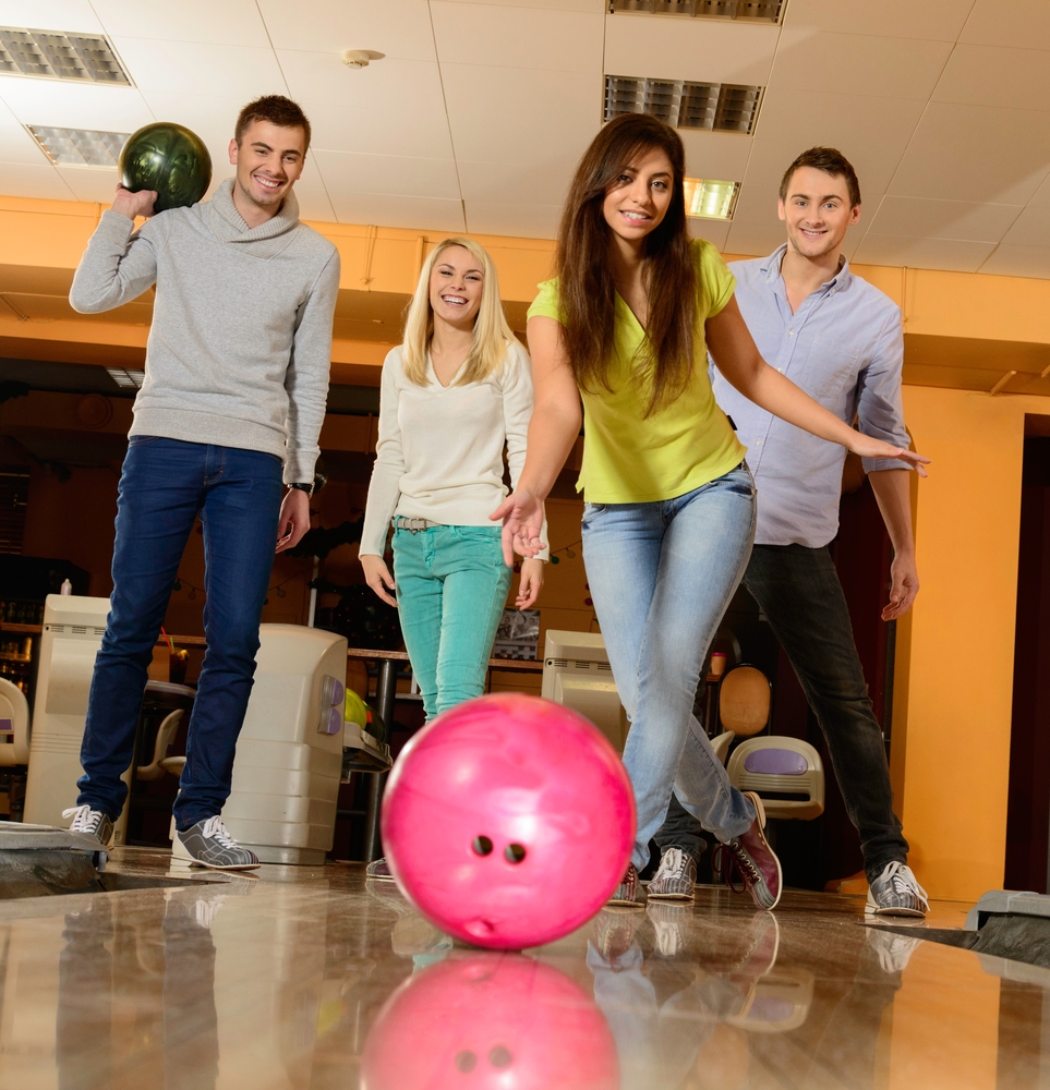 The lady bowler in the yellow shirt used a versatile bowling ball that works on dry and heavily oiled lanes.