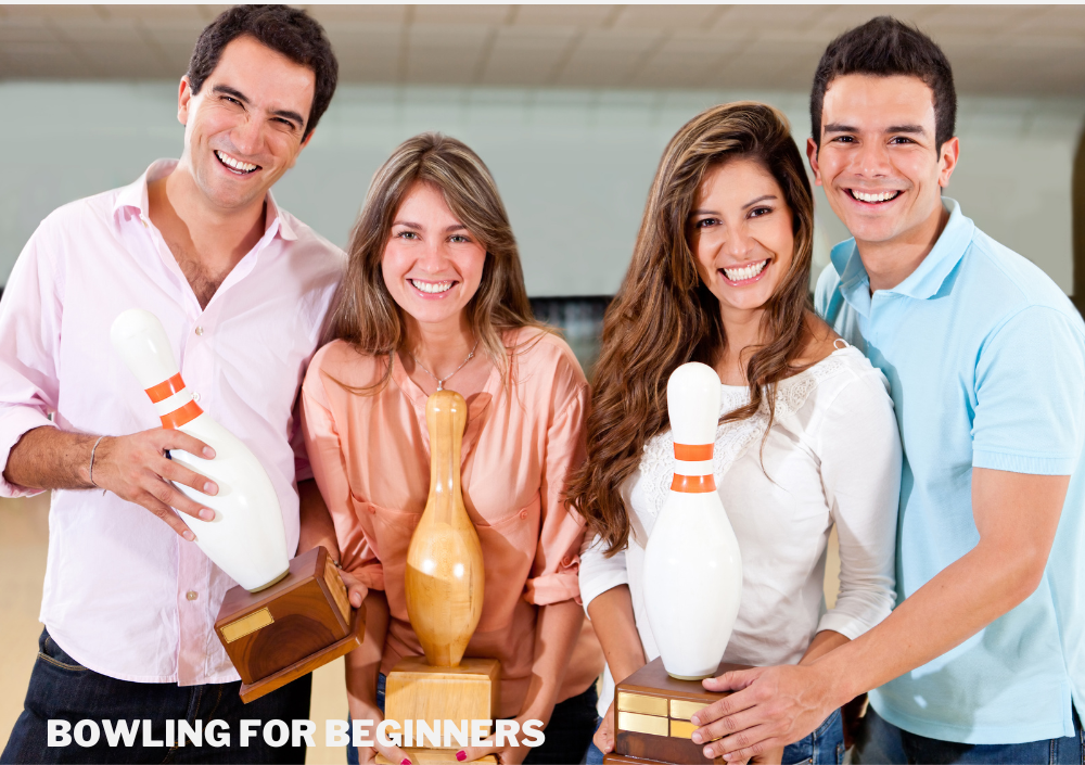 Four bowlers holding bowling trophies they won from the bowling tournament.