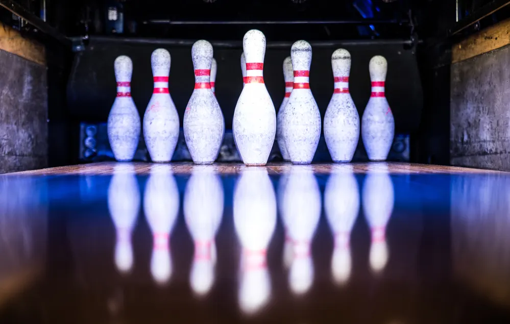 Ten Pin Bowling Pins On A Lane .webp