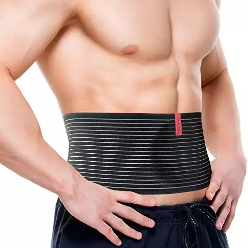 Abdominal hernia support binder with compression pad
