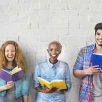 These five friends are leaning against white wall reading bowling books