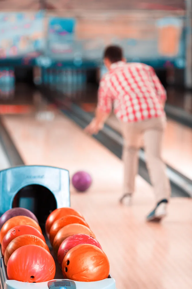 Guy in red and white checkered shirt is the average bowler releasing at the average ball speed.