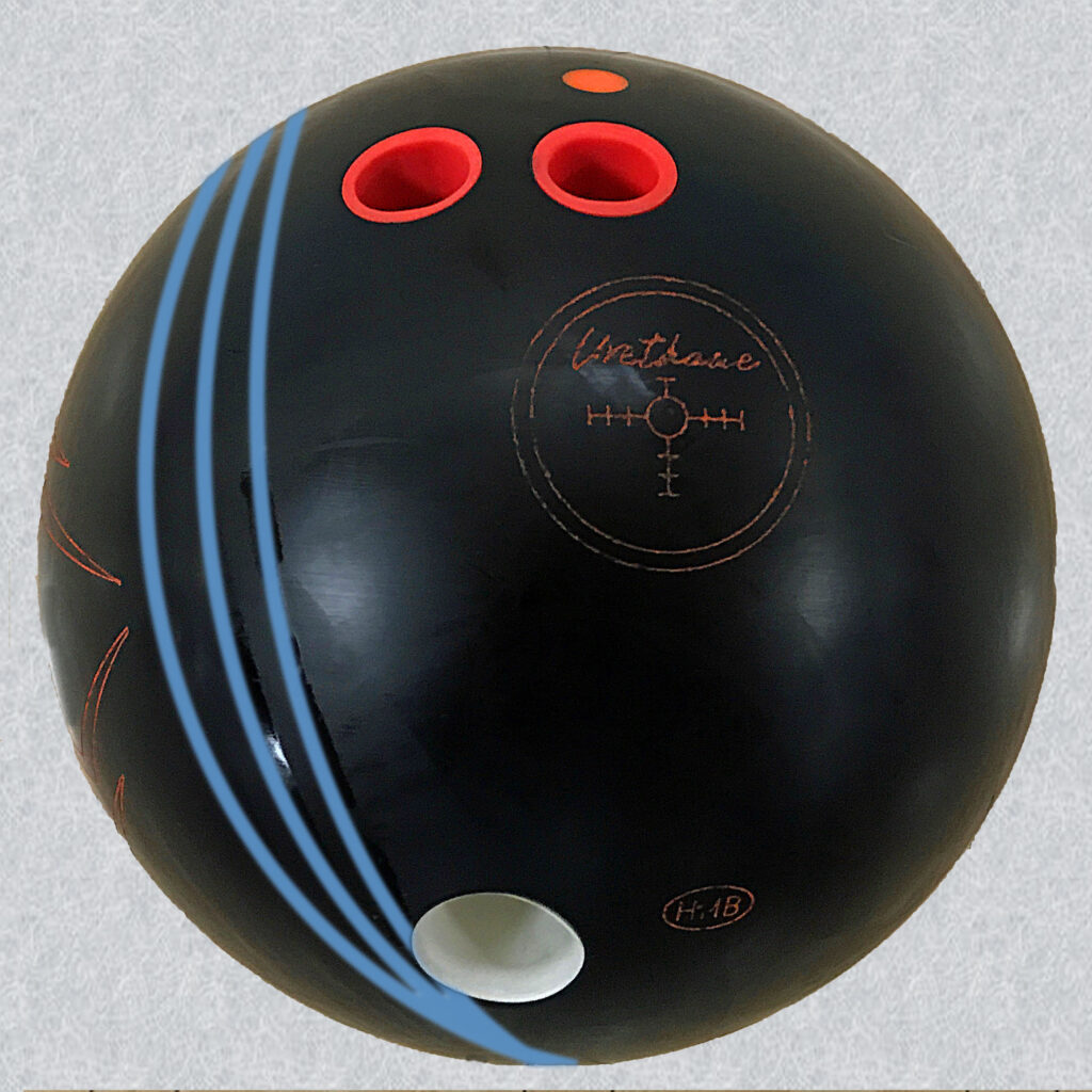 Black urenthane bowling ball that has oil rings from the bowling lanes