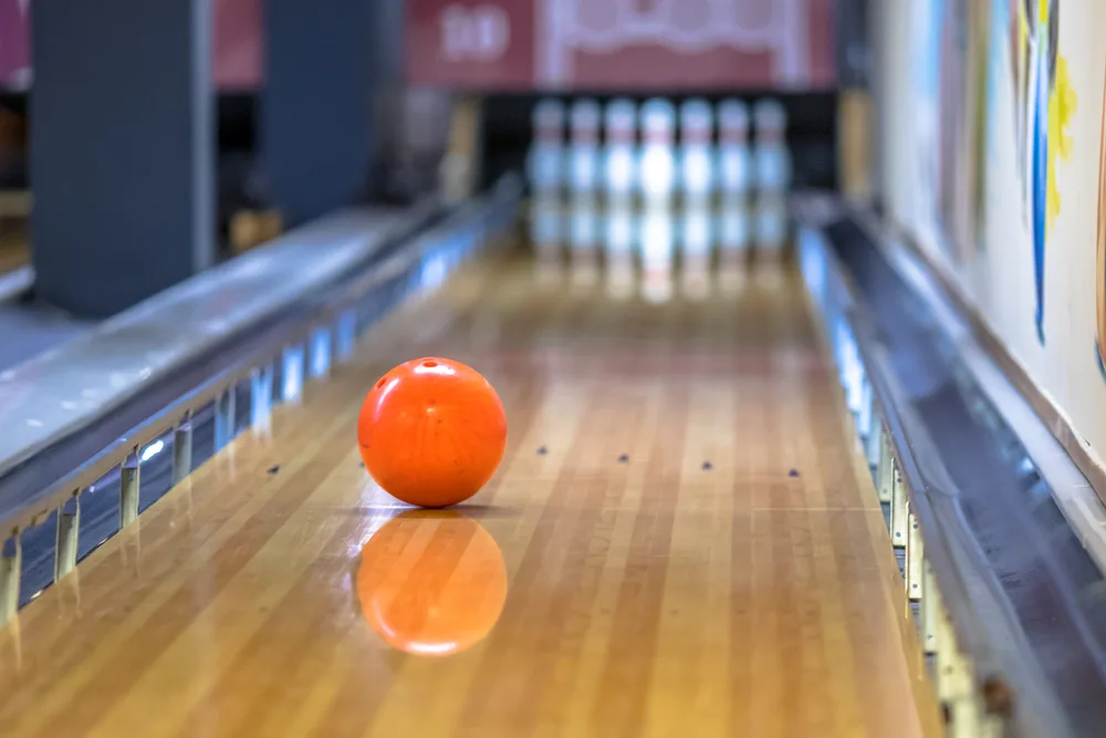 Bowling ball on the lane sits on a lane pattern