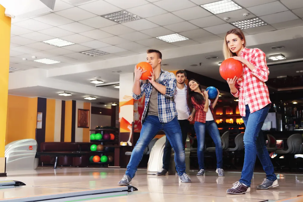 Two bowling teams participating in scratch league bowling